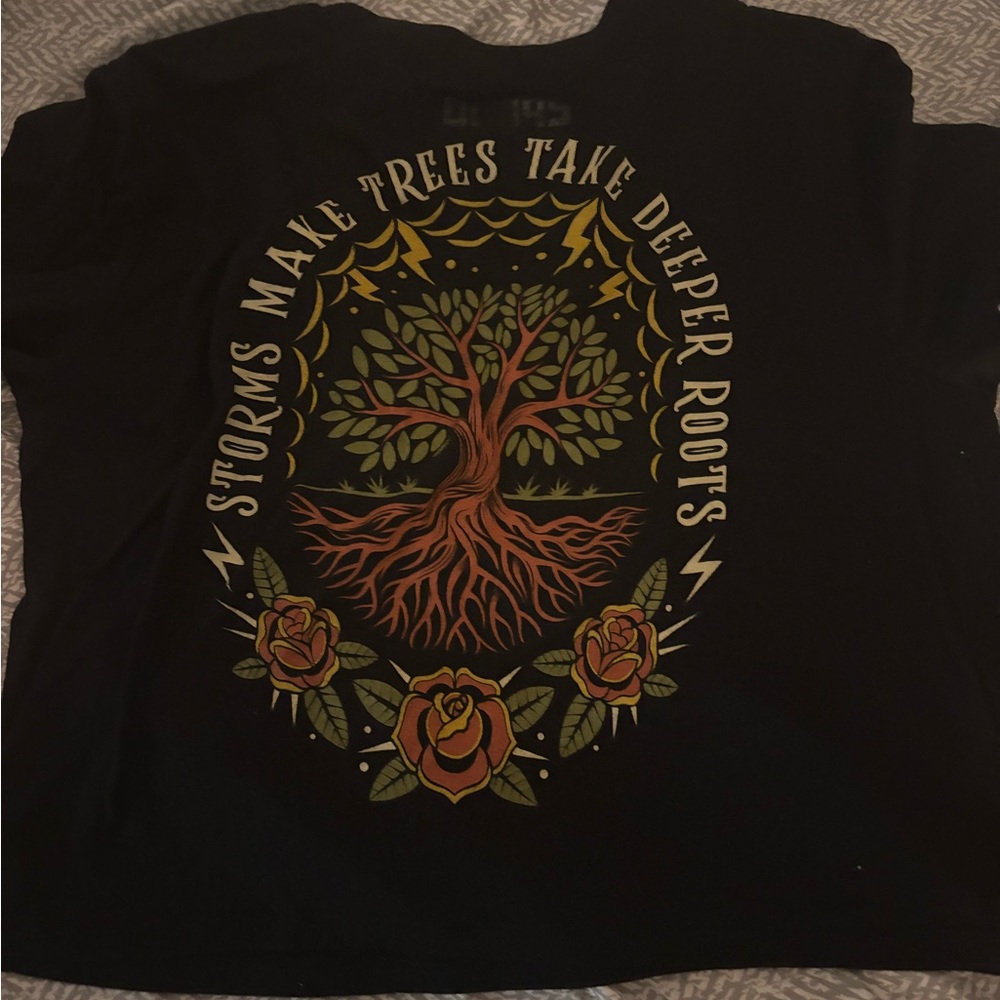 Black Graphic Tee with Tree & Roses - "Storms Make Trees Take Deeper Roots"